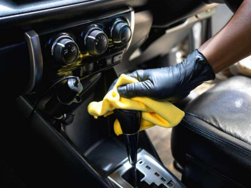 Car interior cleaning and detailing service removing dirt from dashboard and console in Sydney